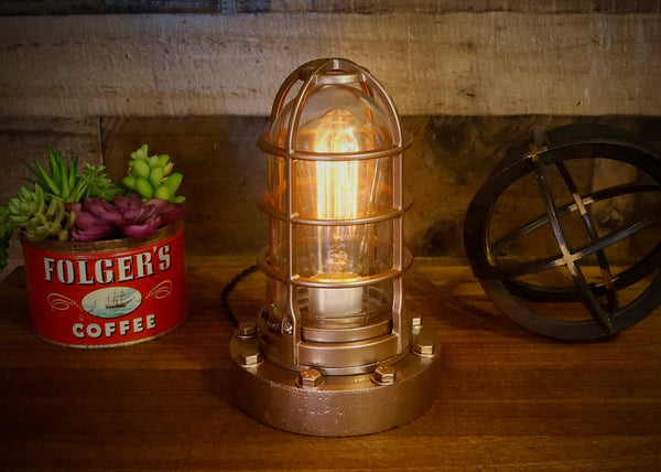 Rustic nautical steampunk deck lamp in antique copper.